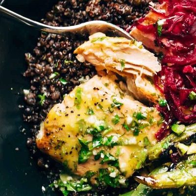 Baked Salmon in a bowl with lentils, green beans, and sauerkraut.