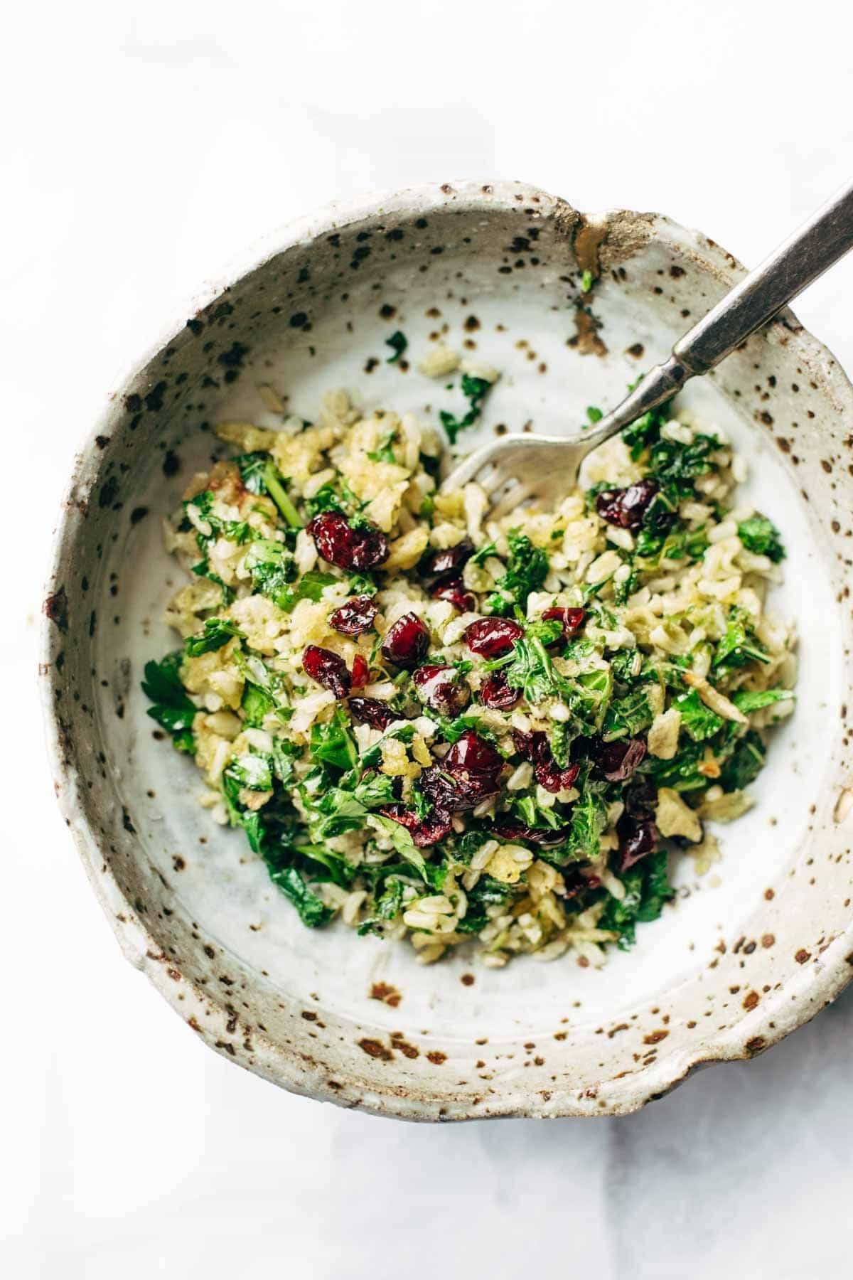 Garlic Kale and Brown Rice Salad with a zippy lemon herb dressing! This side dish recipe is so simple and it compliments almost any main dish! | pinchofyum.com