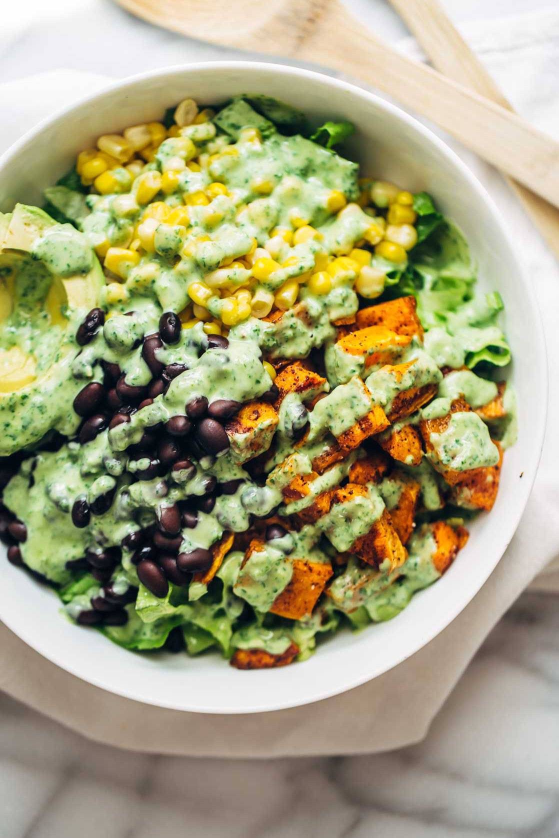 Spicy Southwestern Salad in a serving bowl with avocado dressing.