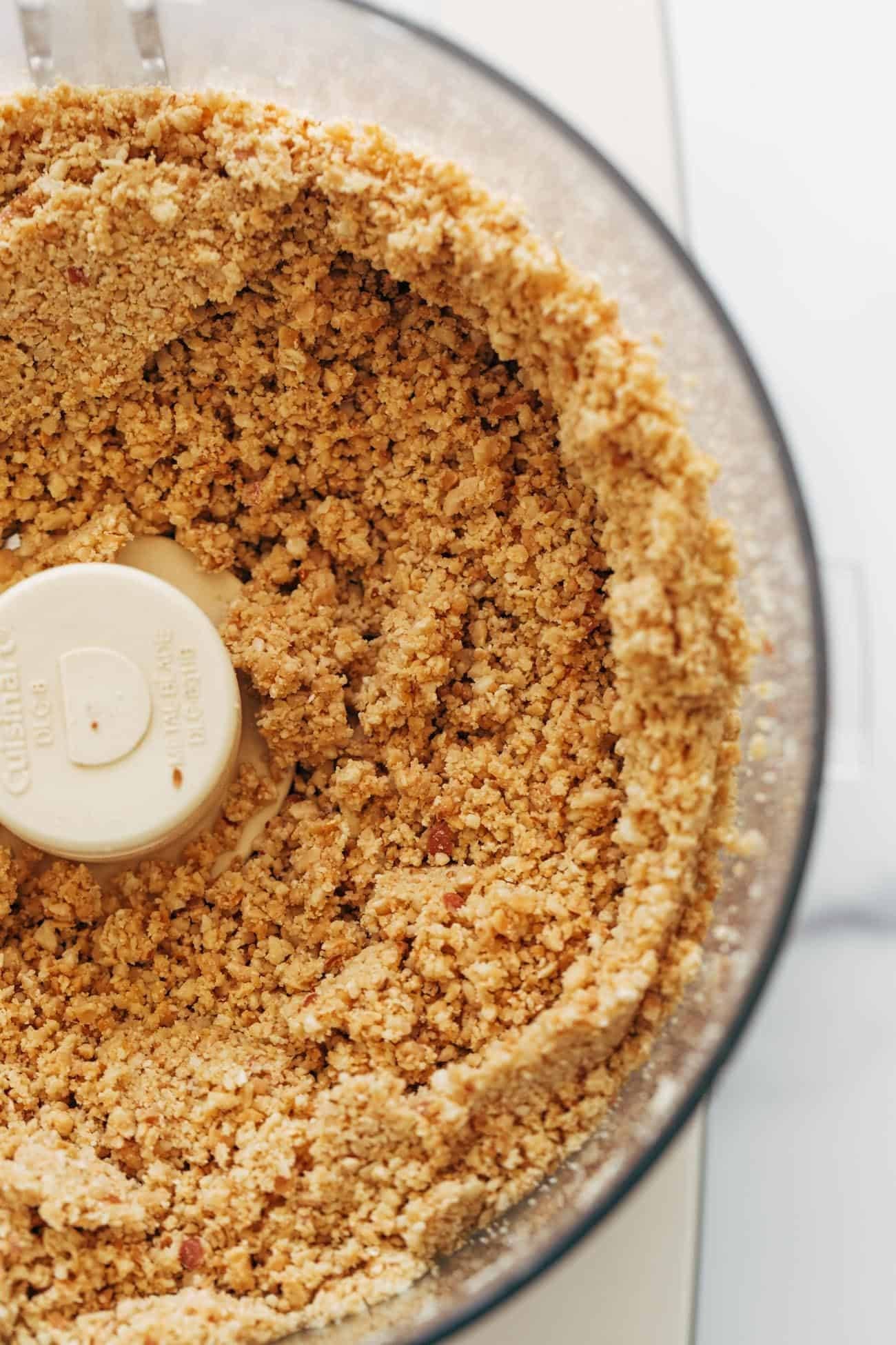 Ground peanuts in a food processor for peanut butter.