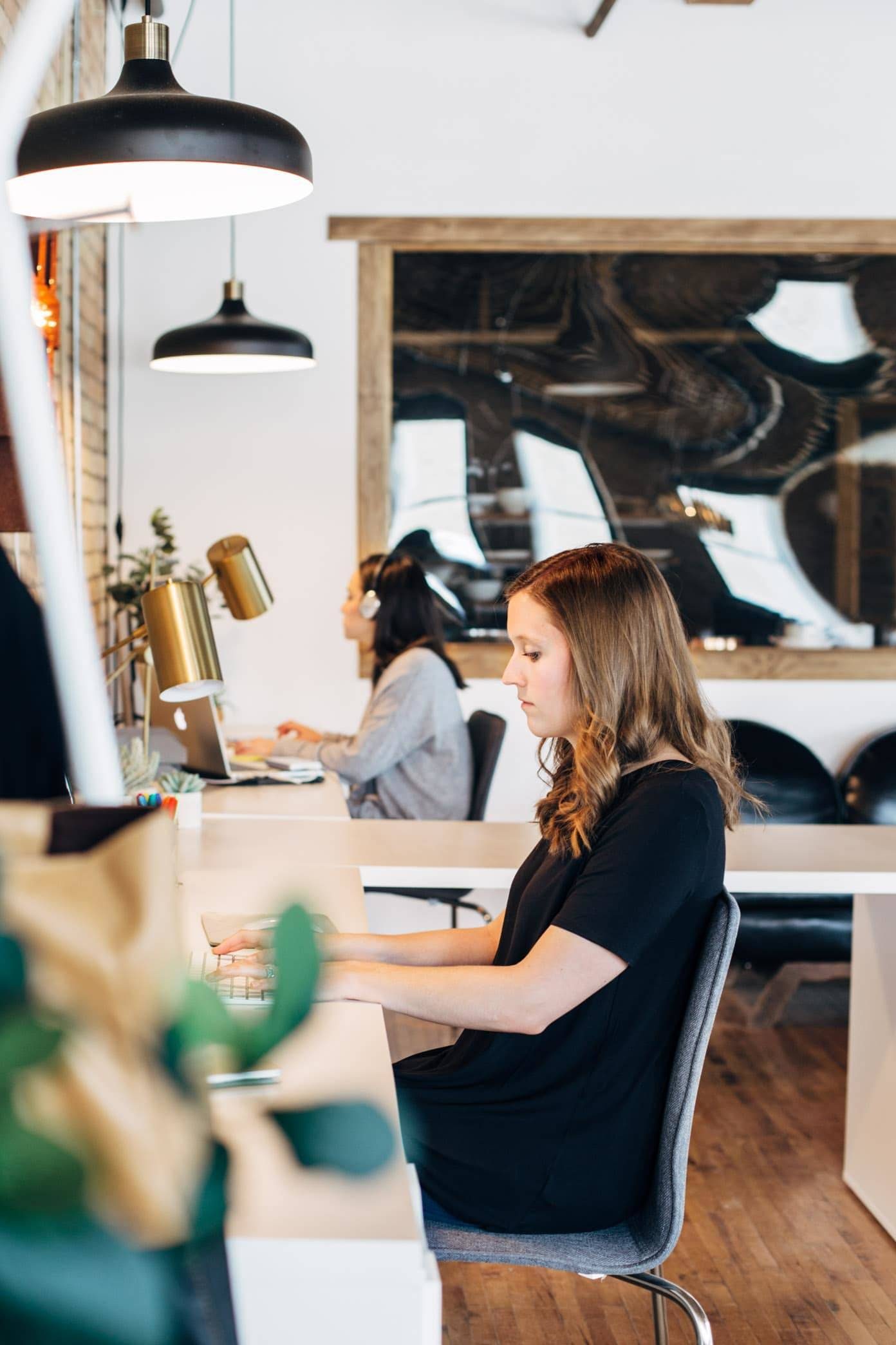 Women working at desks.
